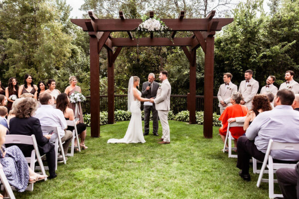 couple and wedding party at the altar