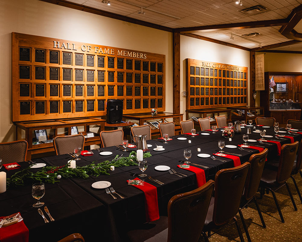 long dining table set with plates and festive decorations