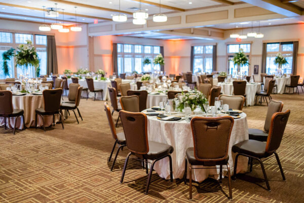tables and chairs with fancy decor in the Grand Ballroom at Bunker Hills Event Center