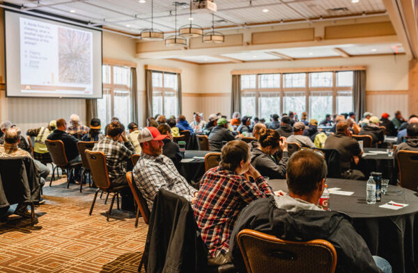 crowd watching a presentation on projector at Bunker Hills