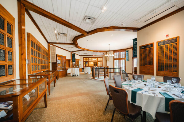 dining tables and chairs set up in the Minnesota Golf Hall of Fame at Bunker Hills Event Center