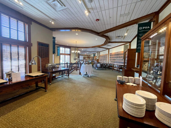 dining tables and chairs set up in the Minnesota Golf Hall of Fame at Bunker Hills Event Center