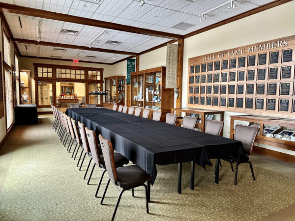 dining table and chairs set up in the Minnesota Golf Hall of Fame at Bunker Hills Event Center