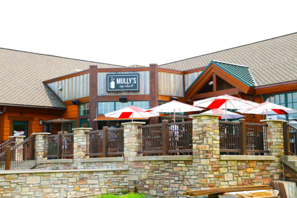 outdoor patio shot of Mully's Patio with colorful umbrellas