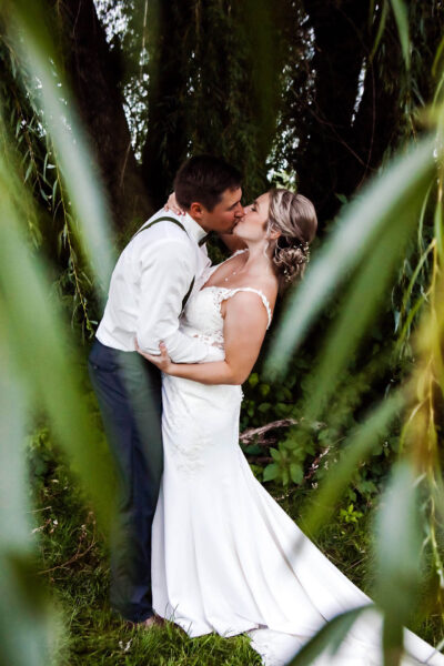 Bride and groom posing for photo