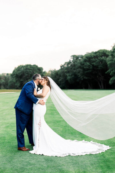 Bride and groom posing for wedding photos