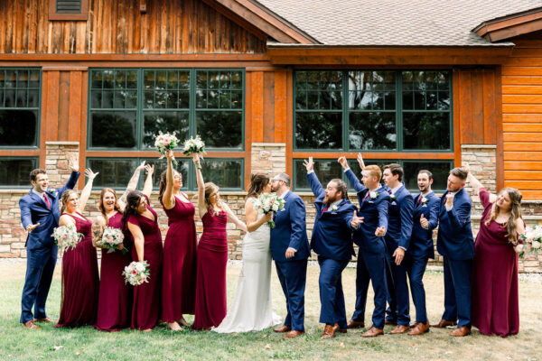 couple and wedding party posing for wedding photos