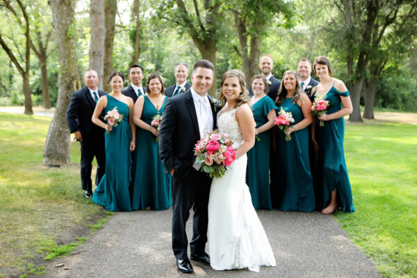 couple and wedding party posing for wedding photos