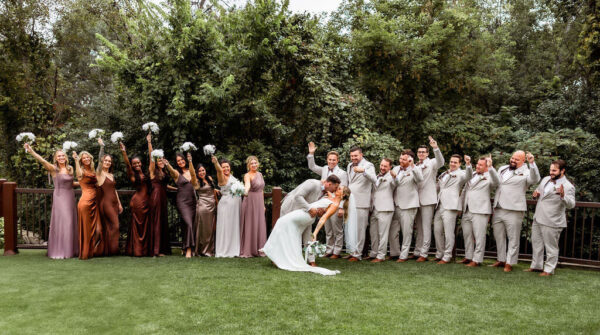 couple and wedding party posing for wedding photos