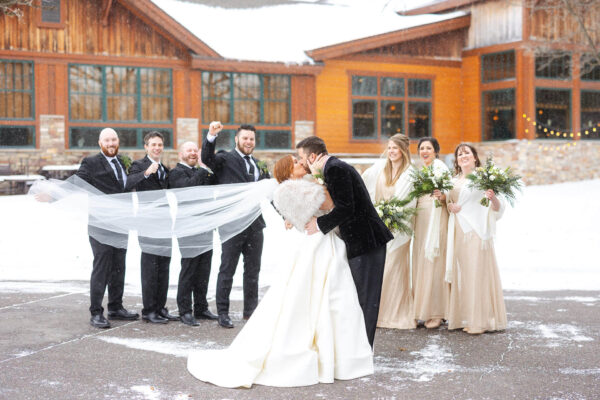 couple and wedding party posing for wedding photos