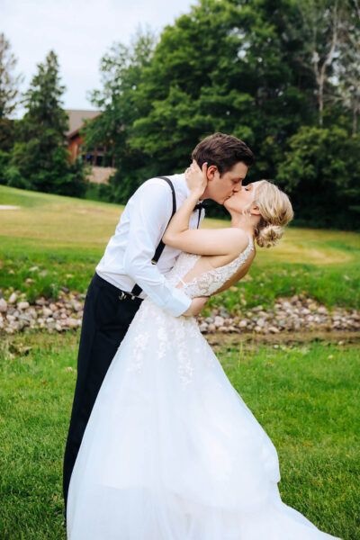 couple posing for wedding photos outdoors