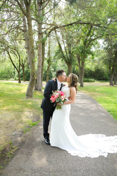 couple posing for wedding photos outdoors