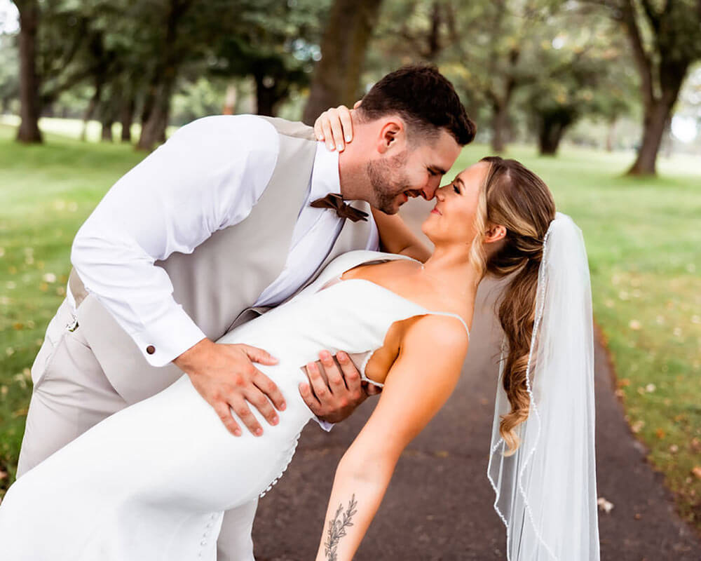 Bride and groom posing for wedding photo