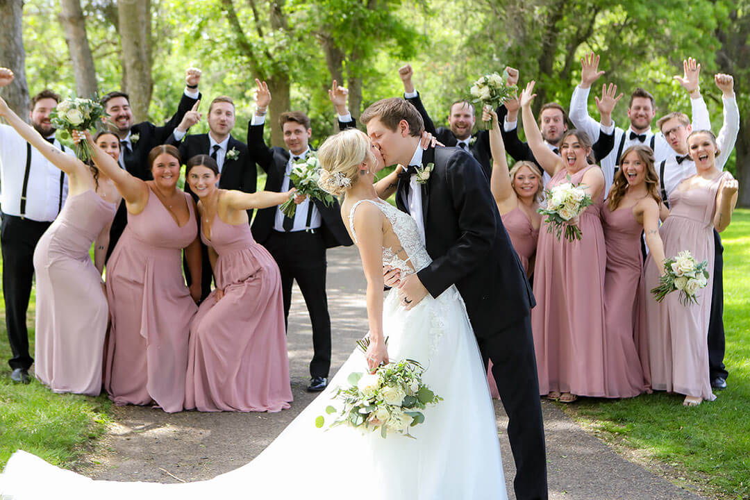 couple and wedding party posing for photo